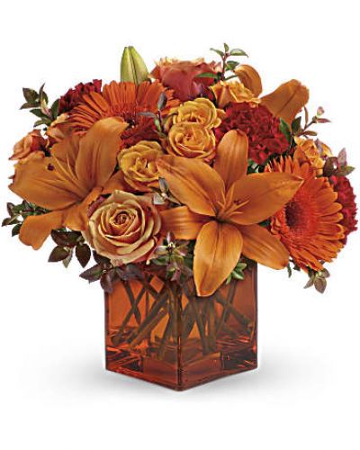 <div id="mark-3" class="m-pdp-tabs-marketing-description">Celebrate the wonder of a new day with warm, golden flowers. A modern orange glass vase is the foundation of this stunning, sun-bright bouquet that energizes any occasion.</div>
<p><del> </del></p>
<p> </p>
<ul>
<li>Orange gerbera daisies, orange roses and red mini carnations are accented with a spray of red huckleberry.</li>
<li>This container is out of stock and will be substituted for a similar, clear vase.</li>
</ul>
<div id="desc-3"></div>
<p> </p>
<p> </p>